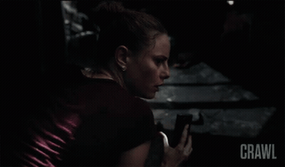Woman In Dark Room Saying Crawl GIF