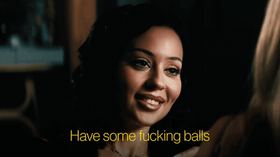 Woman In Dark Room Saying Have Some Fucking Balls GIF