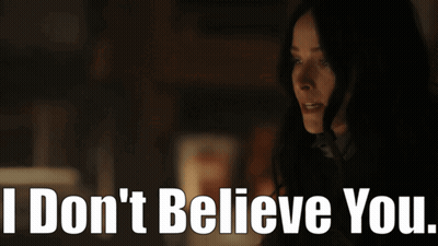 Woman In Dark Room Saying I Don't Believe You GIF
