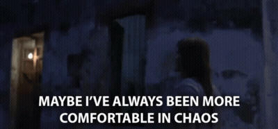 Woman In Dark Room Saying Maybe I've Always Been More Comfortable In Chaos GIF