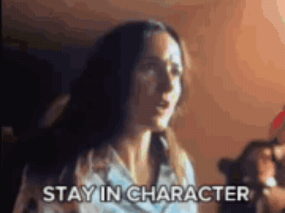 Woman In Dark Room Saying Stay In Character GIF