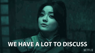 Woman In Dark Room Saying We Have A Lot To Discuss GIF