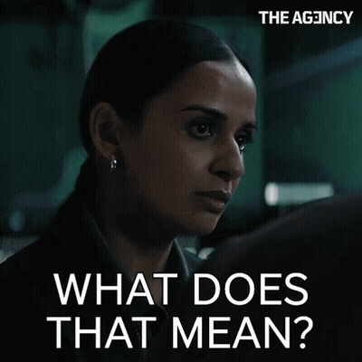 Woman In Dark Room Saying What Does That Mean GIF