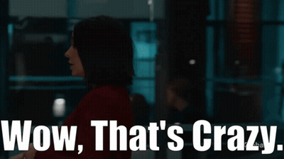 Woman In Dark Room Saying Wow That's Crazy GIF