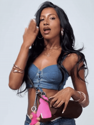 Woman In Denim Crop Top Holding Pink Handcuff GIF