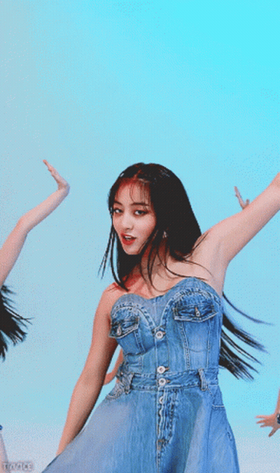 Woman In Denim Dress Dancing In Blue Sky GIF