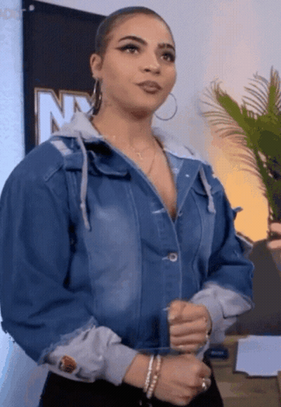 Woman In Denim Jacket At NY Sign GIF