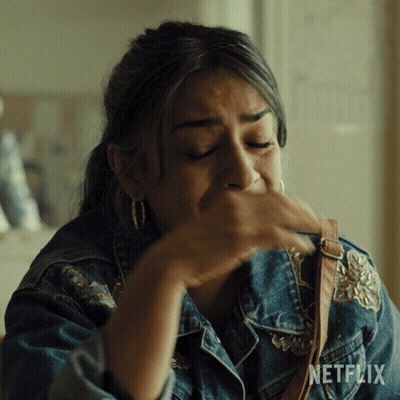 Woman In Denim Jacket Crying With Netflix Logo GIF