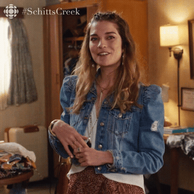 Woman In Denim Jacket In Front Of Wardrobe #Schitts Creek GIF