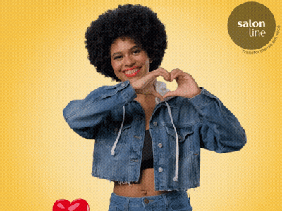 Woman In Denim Jacket Making Heart Shape GIF