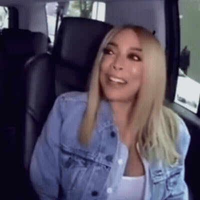 Woman In Denim Jacket Sitting In Back Seat Of Car GIF
