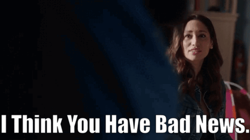 Woman In Denim Jacket Sitting In Living Room GIF