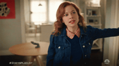 Woman In Denim Jacket With NBC Logo GIF