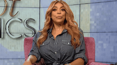Woman In Denim Shirt In Pink Chair With Word Ics GIF