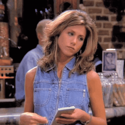 Woman In Denim Vest Holding Paper GIF