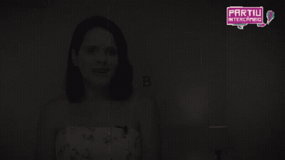 Woman In Detective Hat Holding Magnifying Glass GIF