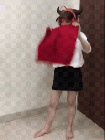 Woman In Devil Costume With Red Cloth Over Head GIF