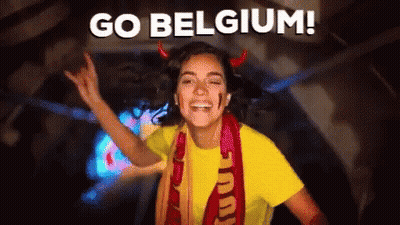 Woman In Devil Horns And Yellow Shirt Saying Go Belgium GIF