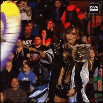 Woman In Diva Outfit In Front Of Crowd GIF