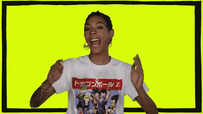 Woman In Dragon Ball Z T-Shirt On Yellow Background GIF