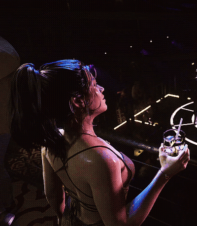 Woman In Dress Holding Drink With Straw GIF