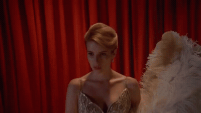 Woman In Dress Holding Ostrich Feather Fan GIF
