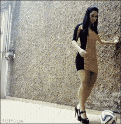 Woman In Dress Kicking Soccer Ball GIF