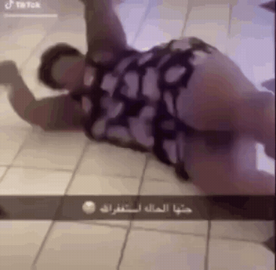 Woman In Dress Lying With Legs Crossed GIF