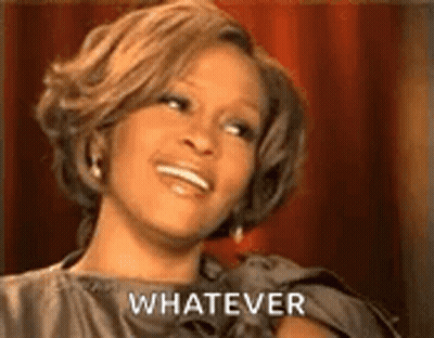 Woman In Dress Smiling Saying Whatever GIF