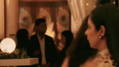 Woman In Dress Standing With Man In Suit GIF