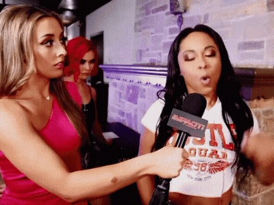 Woman In Duas T-Shirt Being Interviewed GIF