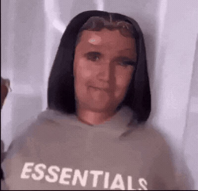 Woman In Essentials Hoodie Looking At Camera GIF