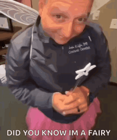 Woman In Fairy Costume Holding Toothpick And Toothbrush GIF