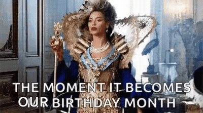 Woman In Fancy Dress Holding Crown And Wand GIF
