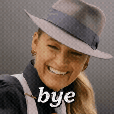 Woman In Fedora Smiling Saying Bye GIF