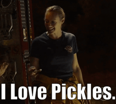 Woman In Fireman Uniform Smiling Says I Love Pickles GIF