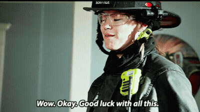 Woman In Fireman Uniform Wow Okay Good Luck GIF