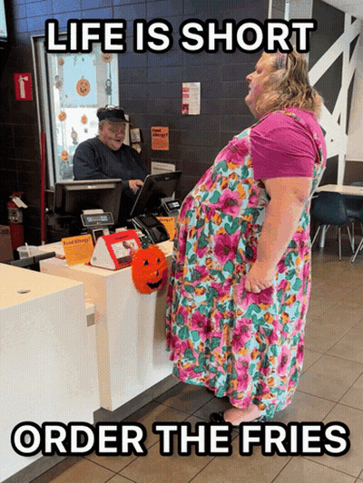 Woman In Floral Dress At McDonald's Counter Saying Life Is Short GIF