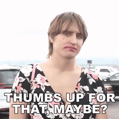 Woman In Floral Dress Giving Thumbs Up GIF