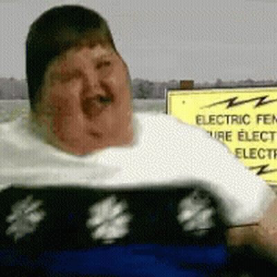 Woman In Floral Dress Holding Chest GIF