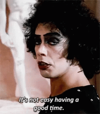 Woman In Floral Dress Holding Water Saying Get A Clue Man GIF