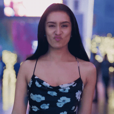Woman In Floral Dress Making Face GIF