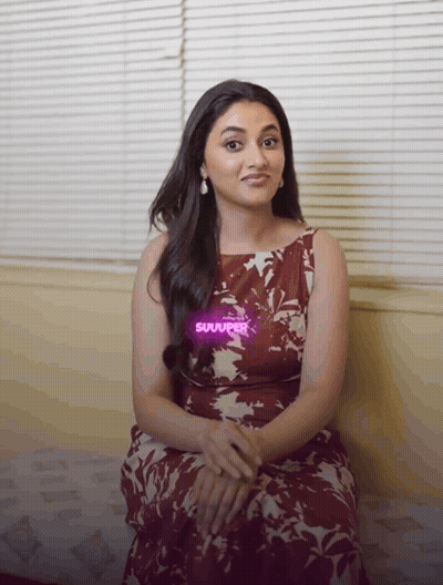Woman In Floral Dress On Couch With Suuuper Sticker GIF
