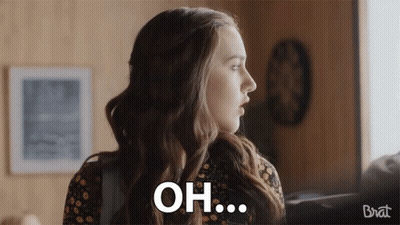 Woman In Floral Dress Saying Oh GIF