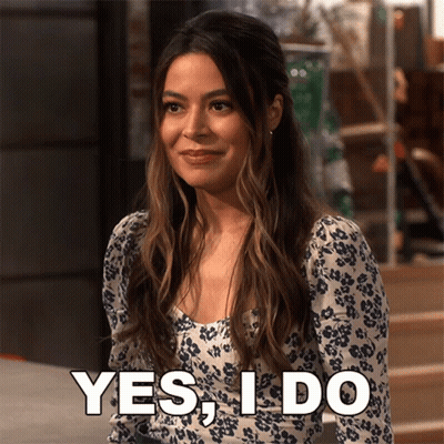 Woman In Floral Dress Saying Yes GIF