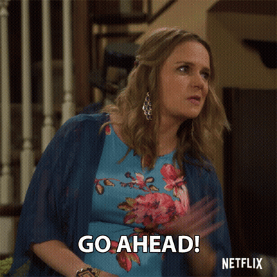 Woman In Floral Dress Says Go Ahead GIF