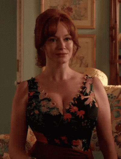 Woman In Floral Dress Sitting GIF