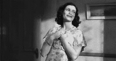 Woman In Floral Dress Standing GIF