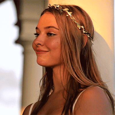 Woman In Floral Headband Smiling GIF