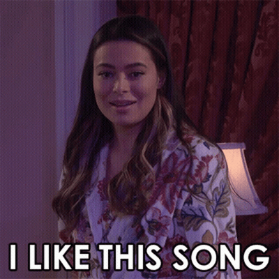Woman In Floral Robe Saying I Like This Song GIF
